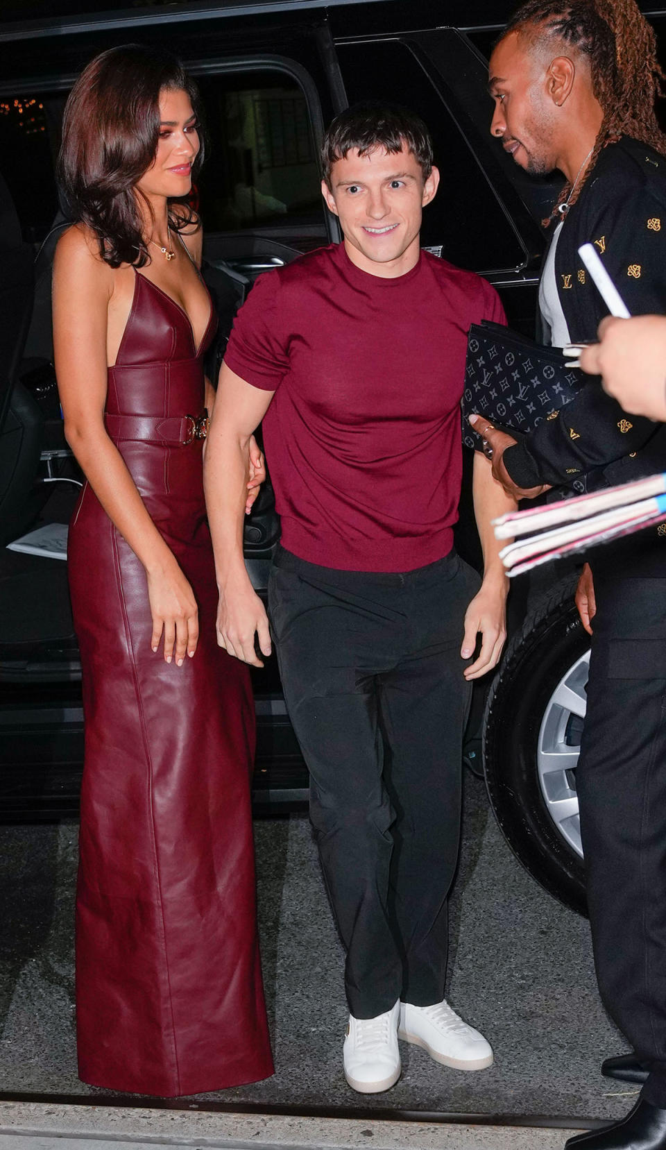 NEW YORK, NEW YORK - OCTOBER 24: Tom Holland and Zendaya wearing a red leather louis vuitton dress are seen leaving the Corner Bar on October 24, 2024 in New York City. (Photo by James Devaney/GC Images)