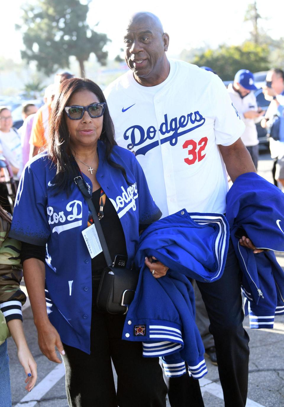 Magic Johnson attend the Dodgers Yankees World Series game one at Dodgers Stadium in L.A.