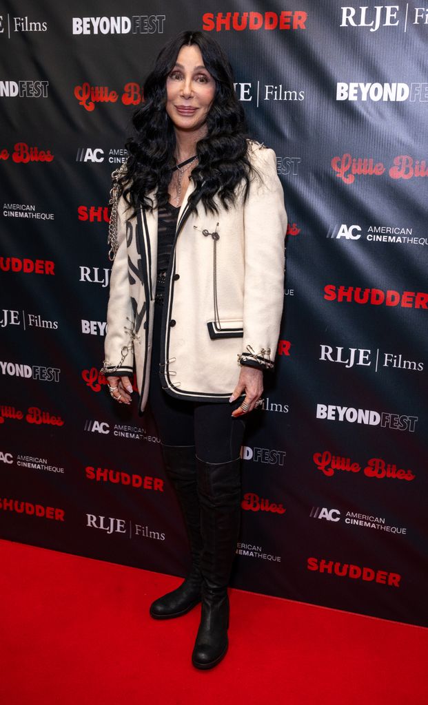 Cher on red carpet in white wool blazer