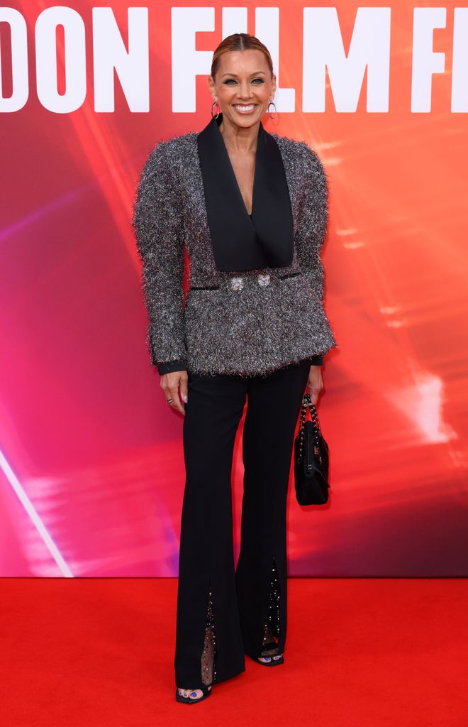 Vanessa Williams in a silver blazer and flares