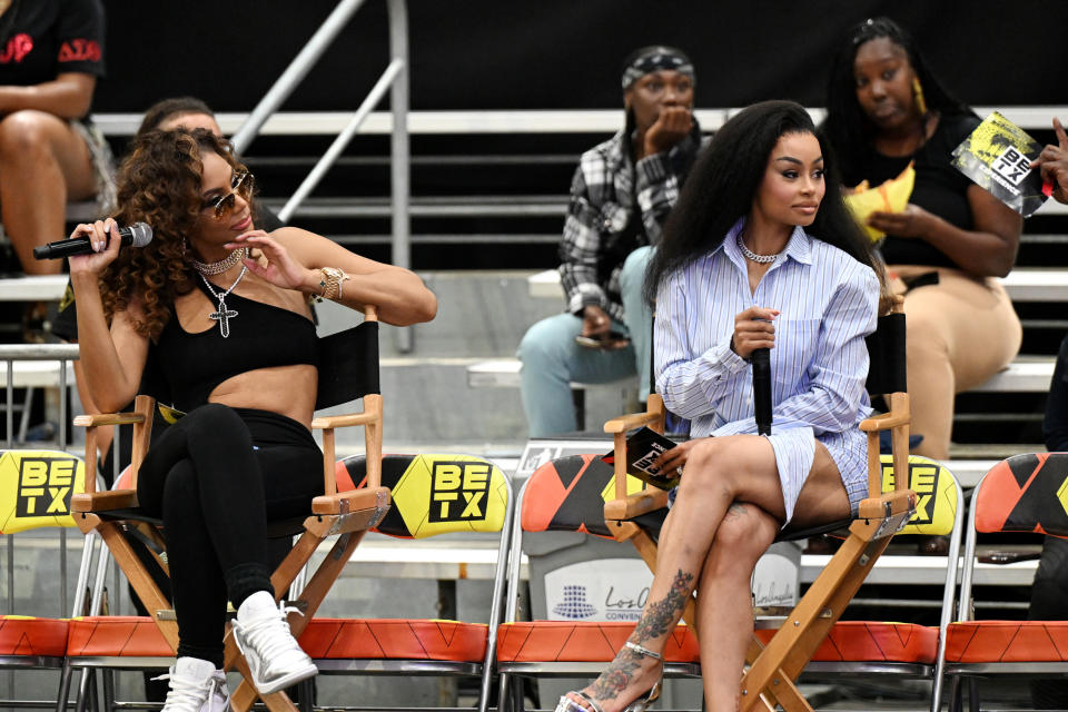 Tamar Braxton and Blac Chyna sit in director chairs at a BET event