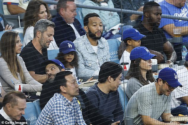 Singer John Legend was also at the game, as he sat with his children at Dodger Stadium