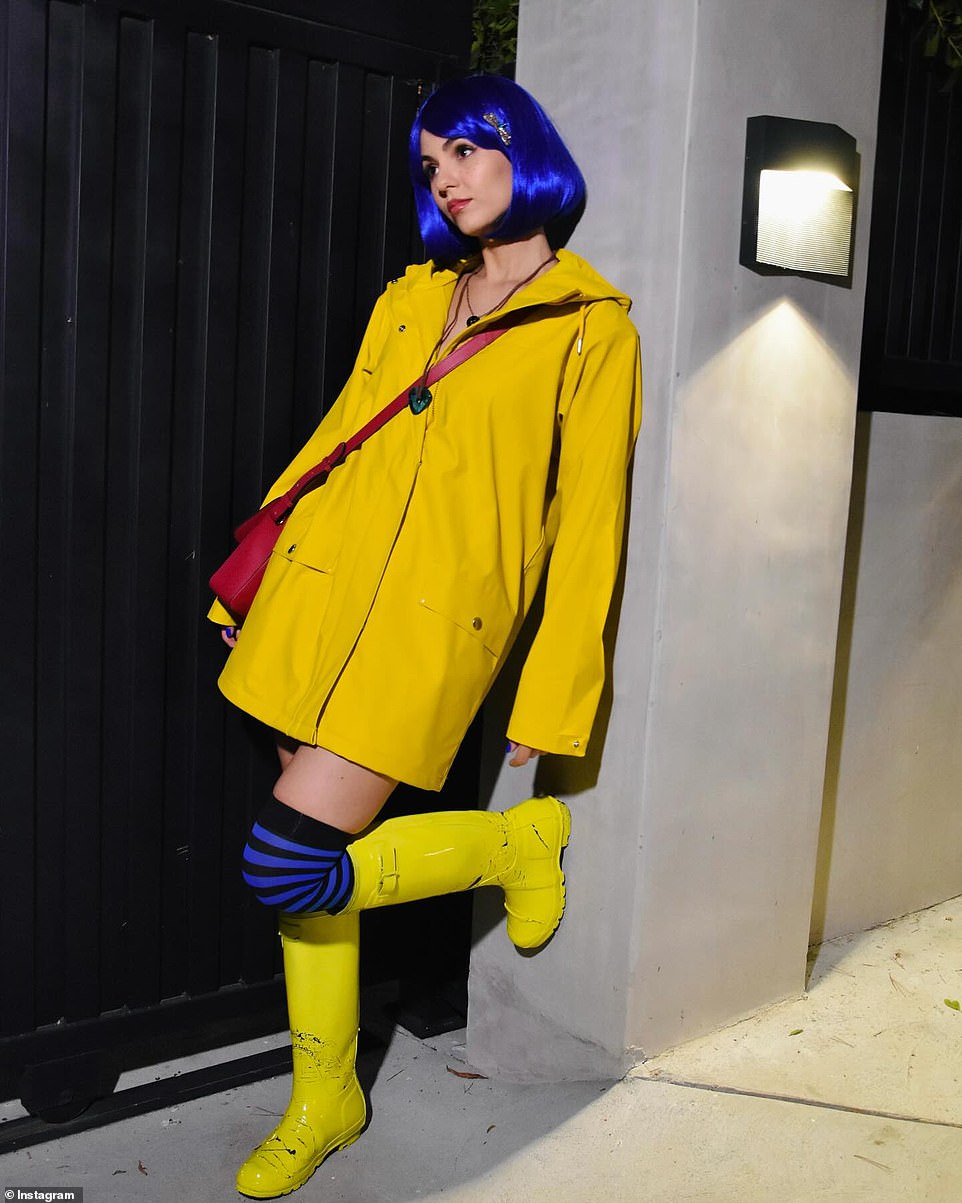 She later transformed into Coraline Jones from the 2009 movie Coraline. Her costume included an electric blue wig and a yellow raincoat, underneath which she wore a black bra and matching skirt