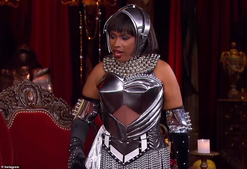 She wore a metallic look with a helmet and black gloves