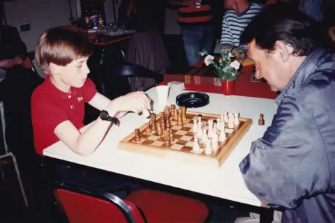 The Passage Prince William playing chess at homeless charity The Passage, in central London, in June 1993