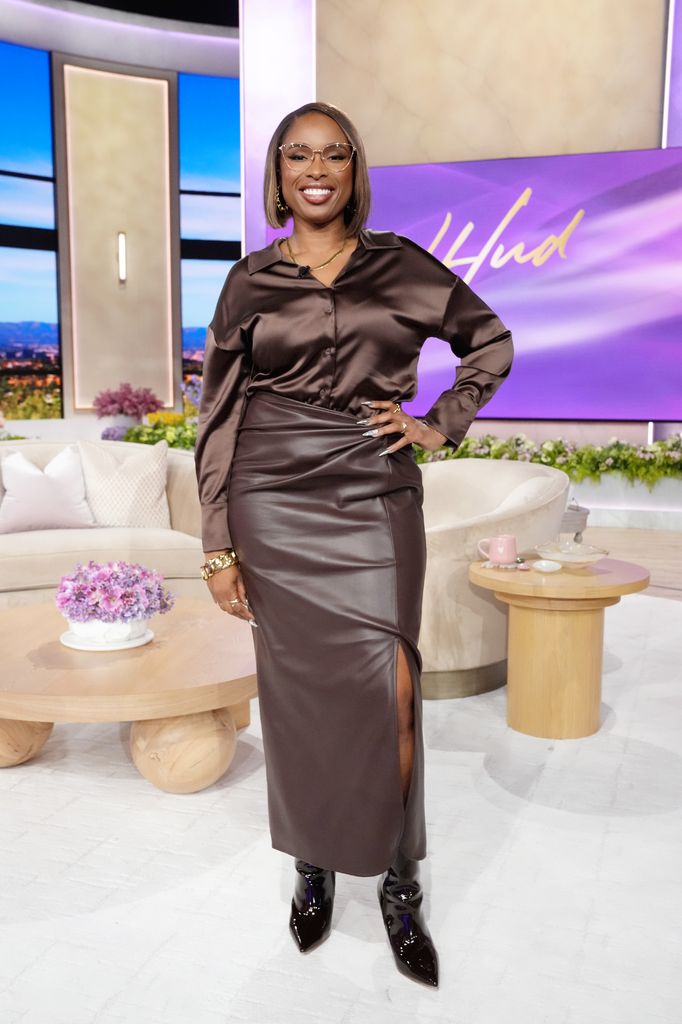 Jennifer Hudson in brown leather skirt and silk shirt