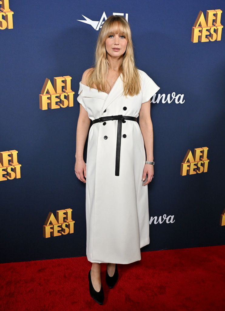 Jennifer Lawrence on red carpet in white blazer midi dress