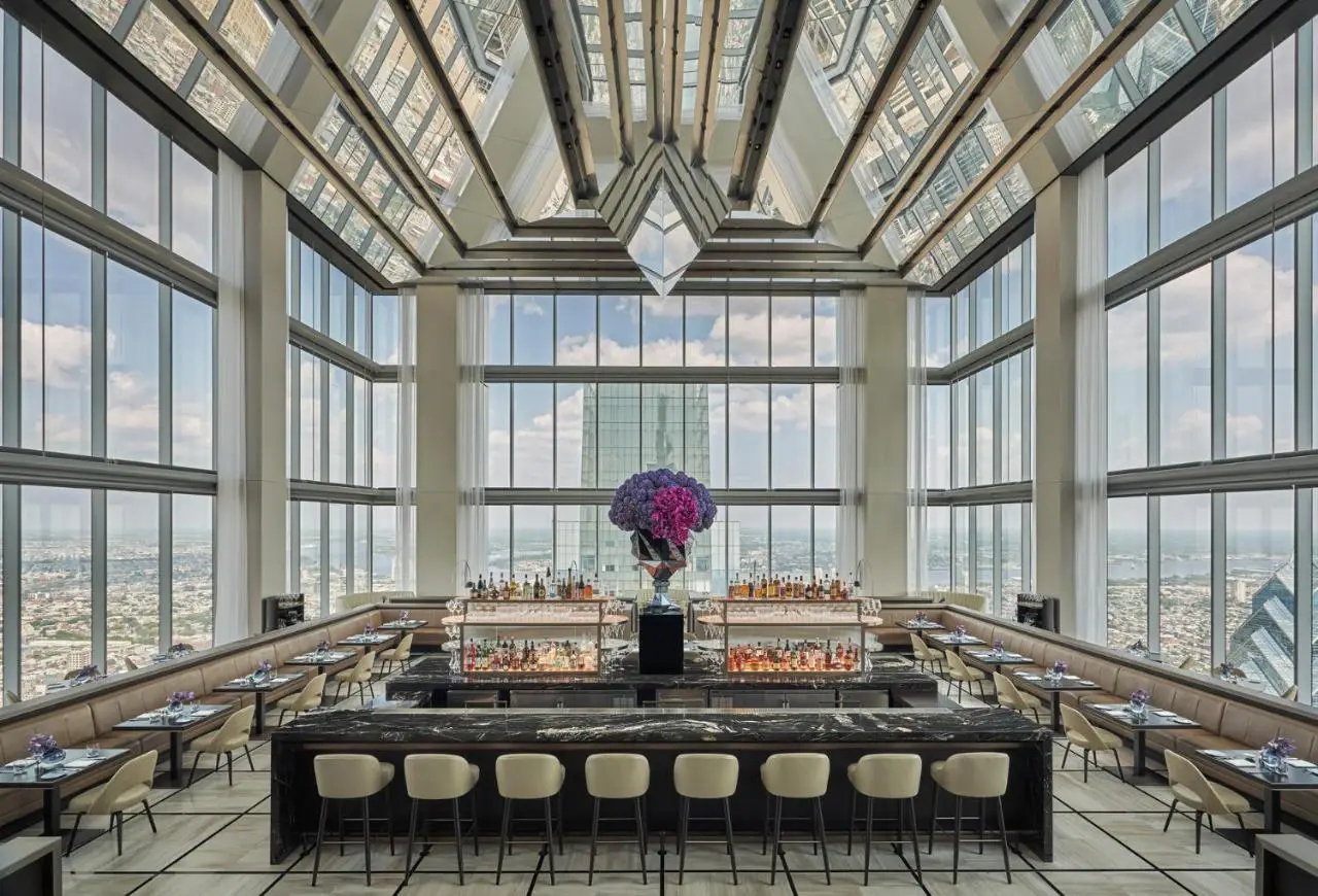 The chic bar and dining area at Four Seasons Hotel Philadelphia at Comcast Center, one of Philly's celebrity-approved hotels, offers panoramic city views.