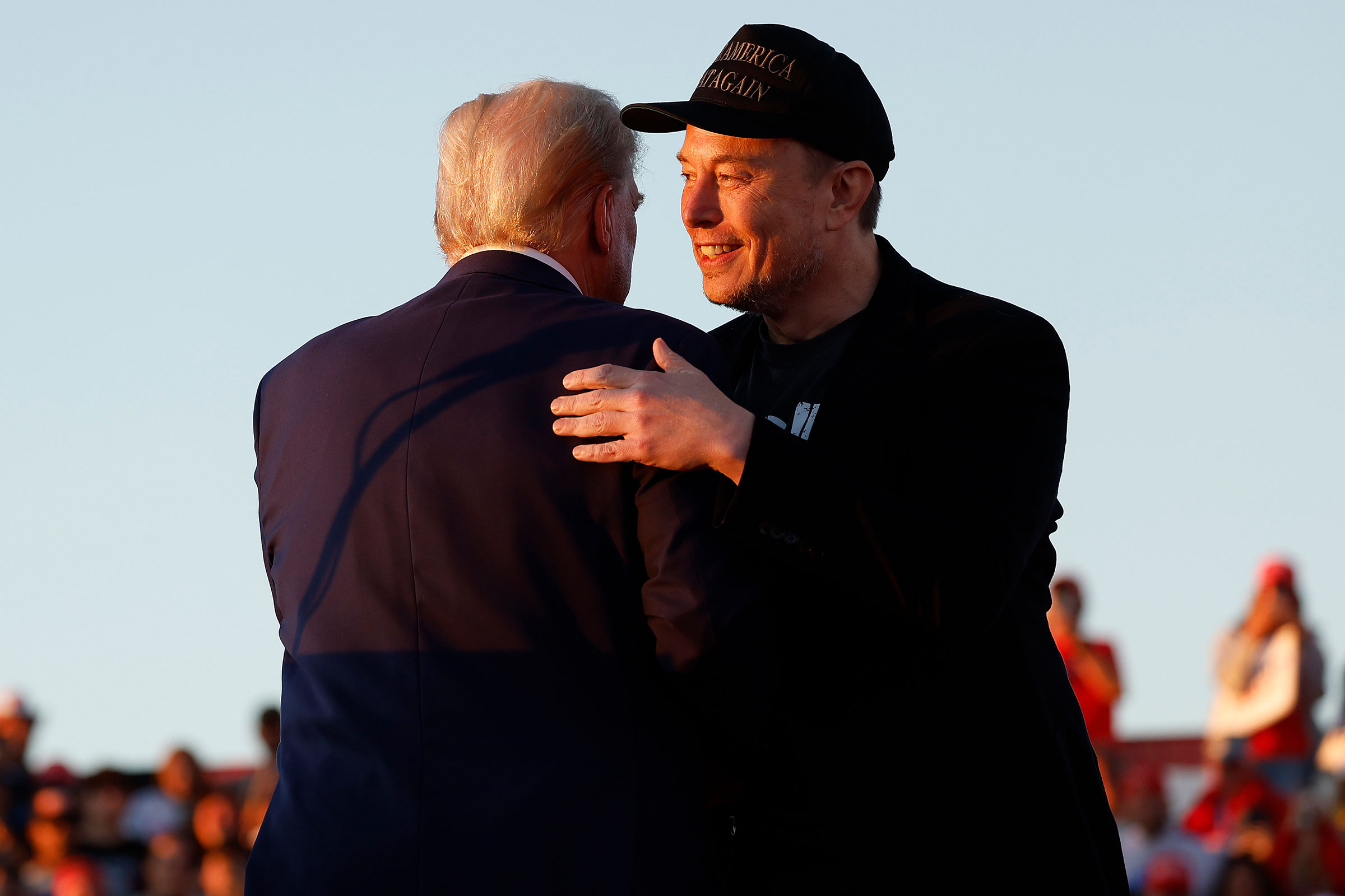 Elon Musk embraces Trump during a campaign rally in Butler, Pa. on Oct. 5.