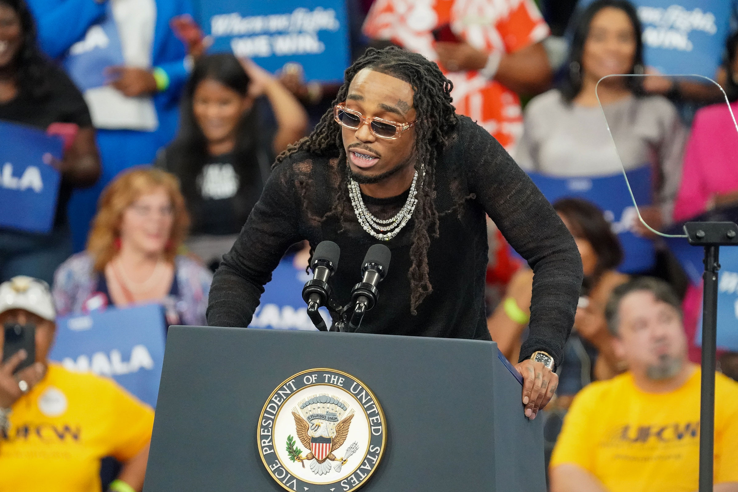 Quavo speaks onstage at a campaign rally in Atlanta on July 30.