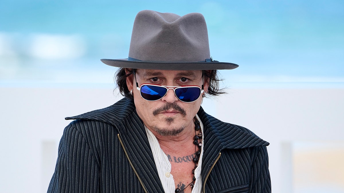 Johnny Depp wears hat and sunglasses at San Sebastian Film Festival