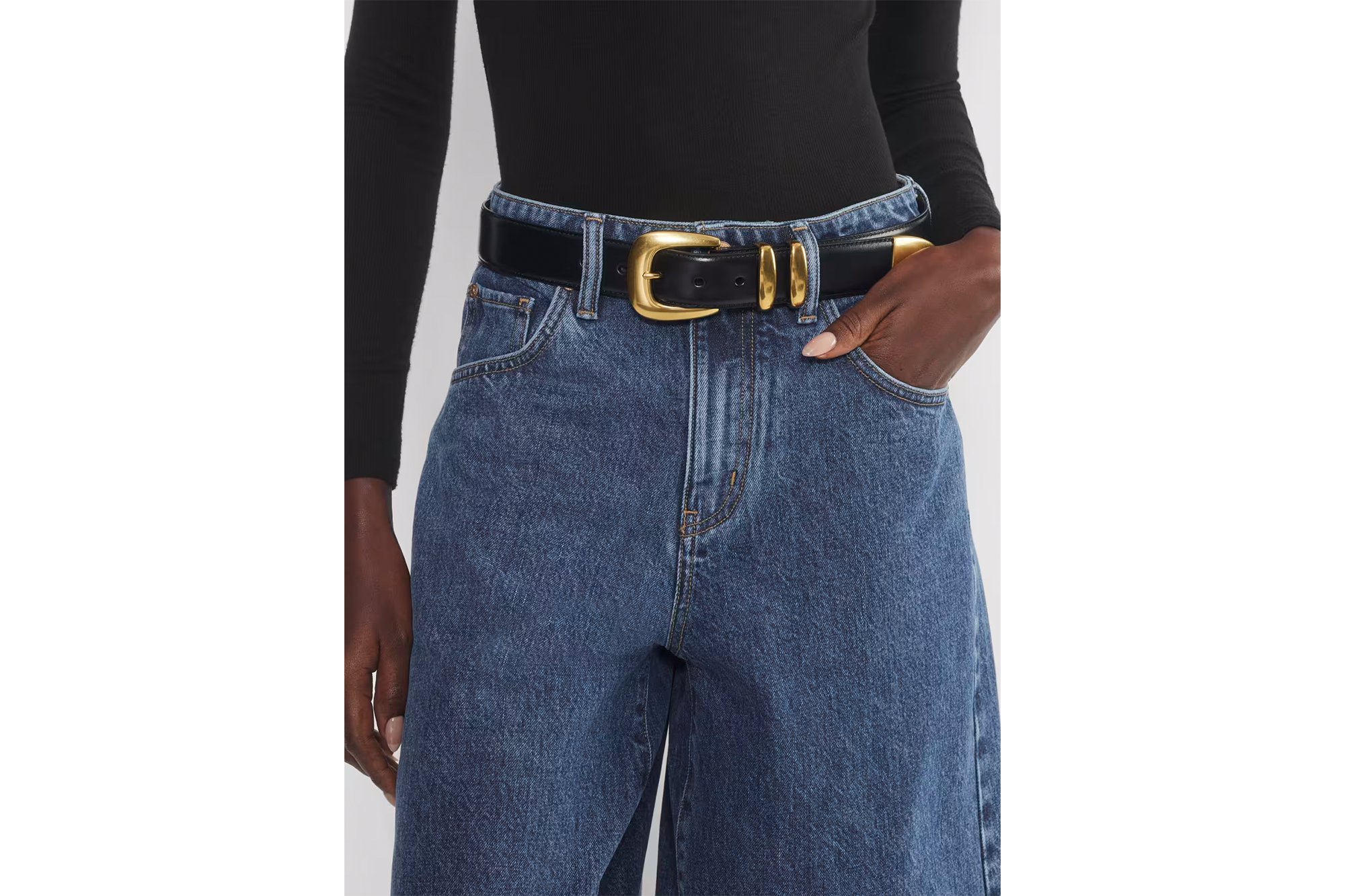 A model in jeans and a belt