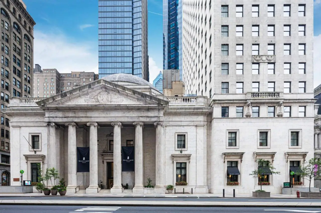 The grand neoclassical facade of The Ritz-Carlton, Philadelphia, featuring towering columns and intricate architectural details.