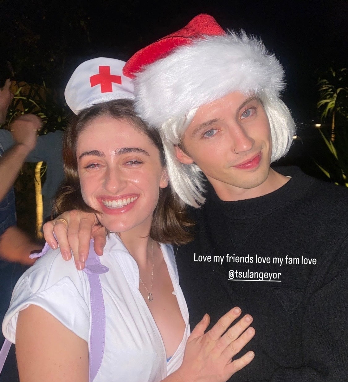 Rachel Sennott dressed as a nurse and Troye Sivan as Mrs. Clause