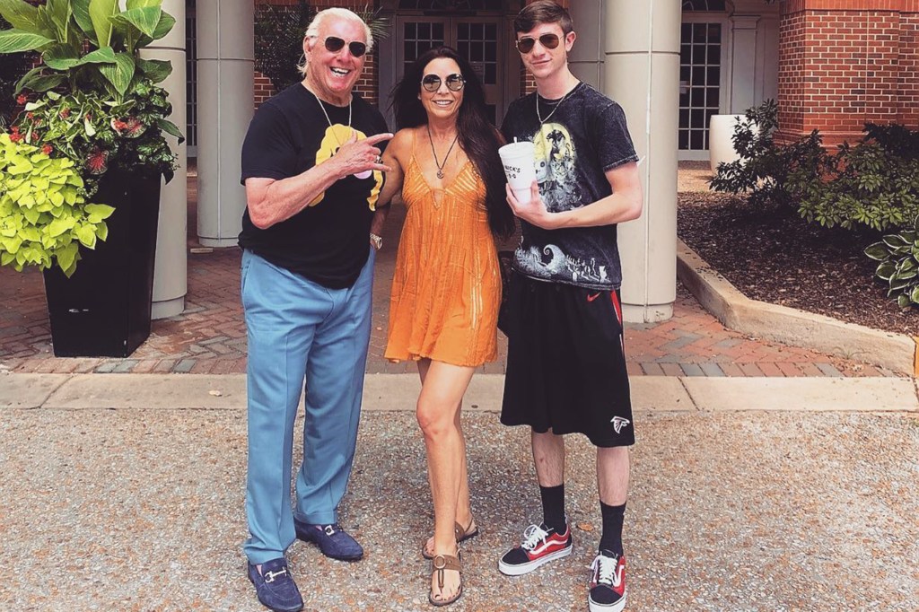 Ric Flair (l.) with Wendy Barlow (c.) and her son Sebastian Kidder (r.)